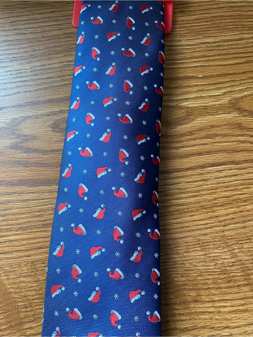 Bespoke Navy Blue Holiday Tie with Red Santa Hat Pattern